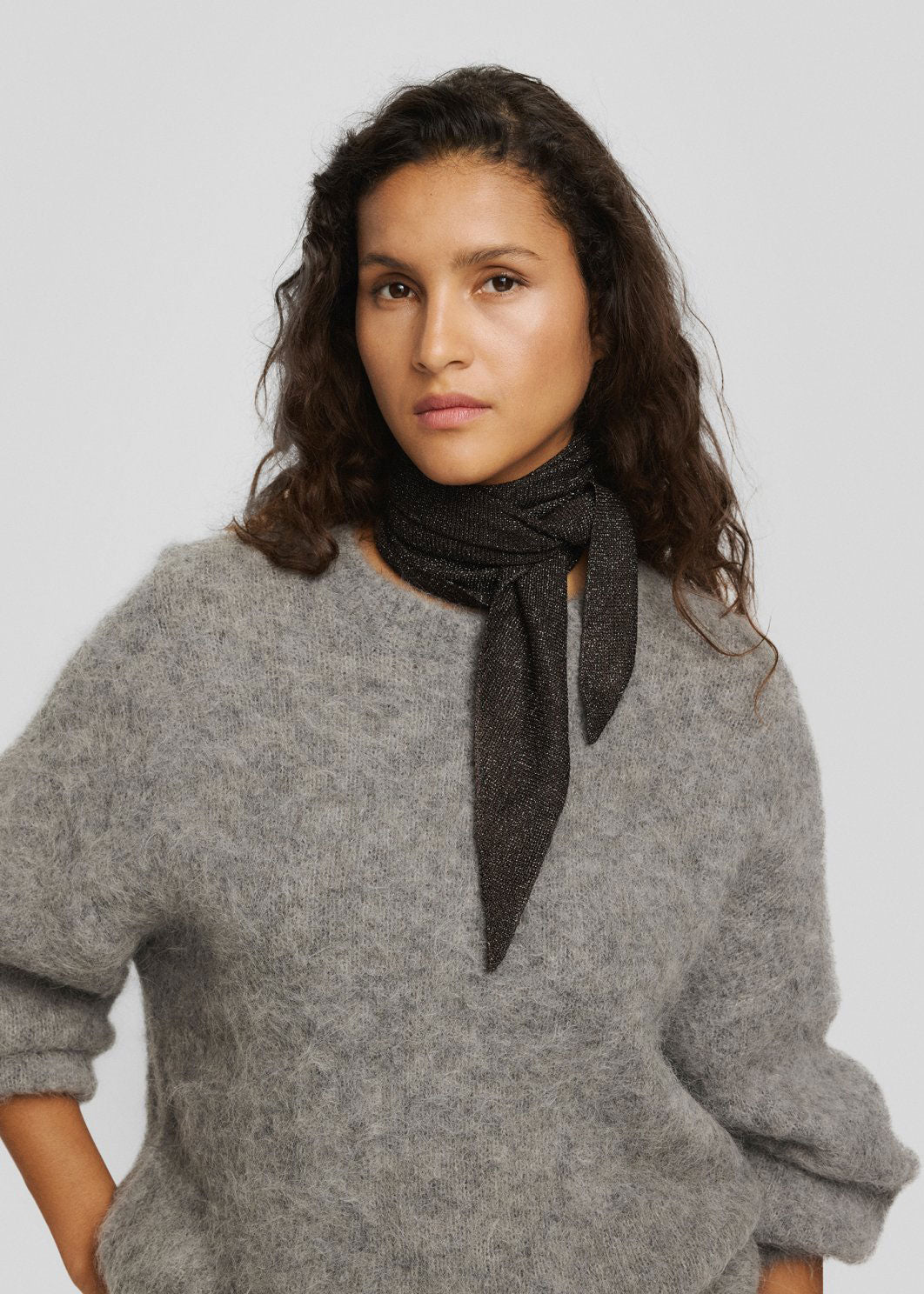 MSCH Copenhagen Knotted neatly at the neck with long tails over a grey fluffy jumper
