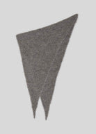 Laid flat to show the long asymmetric triangle shape and fluffy brushed texture