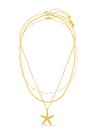 Close-up of the textured starfish pendant on the longest layer