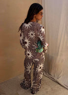 Back view of the wide-leg silhouette in matching shirt co-ord