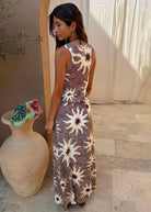 Back view, sleeveless silhouette skimming the body