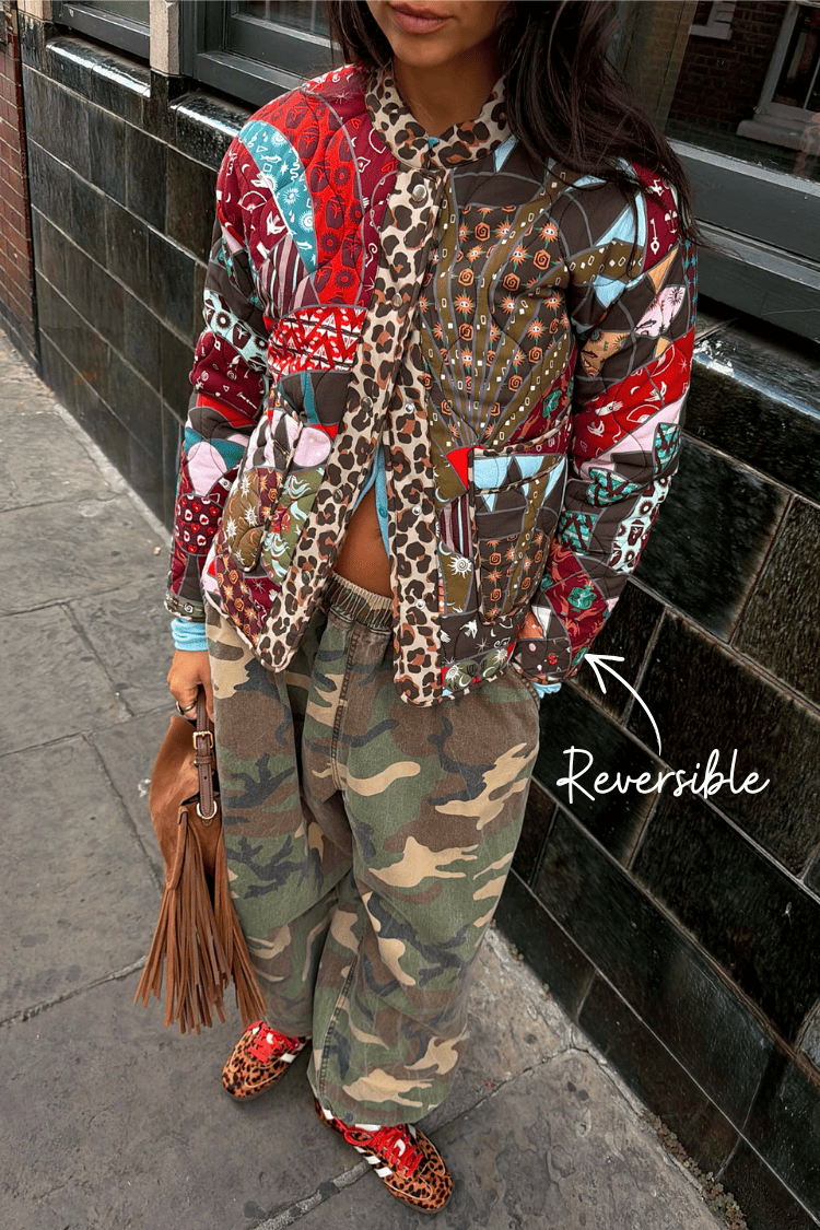 Never Fully Dressed Reversible jacket with an animated arrow pointing out the leopard lining