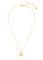 Close-up of the gold crab pincers wrapped around a freshwater pearl
