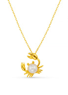 Orelia Pearl Crab charm necklace, gold chain with a crab and pearl-body pendant
