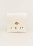 Cream Orelia gift pouch with gold shell logo for the necklace